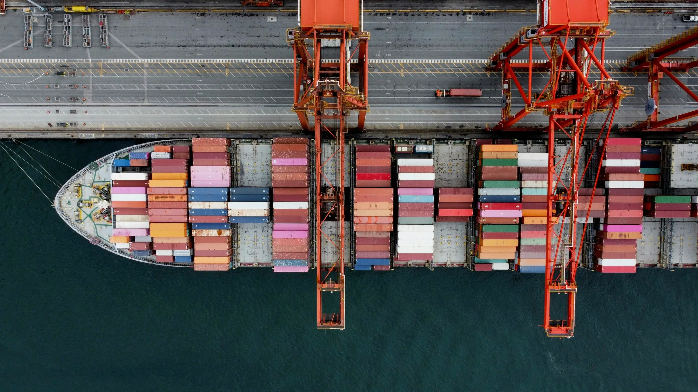 Premium aerial container shipping and terminal view representing the IST operating system